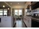 View of the kitchen and dining nook area with stainless appliances and an island with sink at 4933 Greenard Watson Ln, Buford, GA 30518