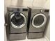 Updated laundry area with modern front-load washer and dryer at 4933 Greenard Watson Ln, Buford, GA 30518