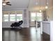 Open floor plan living room features hardwood flooring and a kitchen counter at 4933 Greenard Watson Ln, Buford, GA 30518