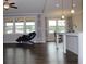 An open-concept living room with large windows allowing plenty of natural light and a comfortable area at 4933 Greenard Watson Ln, Buford, GA 30518