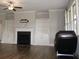 Bright living room featuring a fireplace with white mantel and built-in bookshelves for a cozy, organized space at 4933 Greenard Watson Ln, Buford, GA 30518