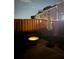 Evening view of the backyard featuring an inviting fire pit and privacy fence at 5008 Whiteoak Pointe Se # 15, Smyrna, GA 30080