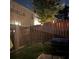Backyard with wood fence and landscape lighting offers an inviting outdoor space at 5008 Whiteoak Pointe Se # 15, Smyrna, GA 30080