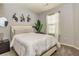 Cozy bedroom with gray walls, carpet flooring, stylish decorations, and a comfortable bed at 5008 Whiteoak Pointe Se # 15, Smyrna, GA 30080