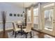 Cozy dining nook with a round table, four chairs, hardwood floors, and natural light at 5008 Whiteoak Pointe Se # 15, Smyrna, GA 30080