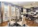 Charming eat-in kitchen with stainless appliances, dark cabinets, and hardwood floors at 5008 Whiteoak Pointe Se # 15, Smyrna, GA 30080