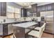 Updated kitchen featuring stainless appliances, island, and subway tile backsplash at 5008 Whiteoak Pointe Se # 15, Smyrna, GA 30080