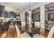 Open floor plan featuring kitchen and living room with coffered ceiling and hardwood floors at 5008 Whiteoak Pointe Se # 15, Smyrna, GA 30080
