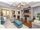 Open living room boasts hardwood floors, coffered ceilings, fireplace, and a comfortable sectional sofa at 5008 Whiteoak Pointe Se # 15, Smyrna, GA 30080