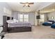 This is a main bedroom area with ceiling fan, bed and sitting area at 5008 Whiteoak Pointe Se # 15, Smyrna, GA 30080