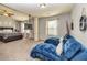 Spacious main bedroom featuring sitting area, TV and ceiling fan at 5008 Whiteoak Pointe Se # 15, Smyrna, GA 30080