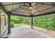 Relaxing backyard featuring large gazebo with fan overlooking landscaping at 1873 Jameson Cir, Lawrenceville, GA 30043