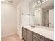 Bathroom features double vanity and large mirror plus shower over tub at 1873 Jameson Cir, Lawrenceville, GA 30043