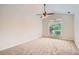 Bright bedroom features vaulted ceiling, neutral carpet, and a ceiling fan at 1873 Jameson Cir, Lawrenceville, GA 30043