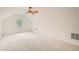Bright bedroom features vaulted ceiling, neutral carpet, and a ceiling fan at 1873 Jameson Cir, Lawrenceville, GA 30043
