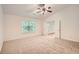 Spacious bedroom with neutral carpet, vaulted ceilings, ceiling fan and double door entry at 1873 Jameson Cir, Lawrenceville, GA 30043