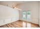Bright dining room with wainscoting and a sliding glass door to the backyard at 1873 Jameson Cir, Lawrenceville, GA 30043