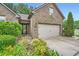 Charming brick home featuring manicured landscaping and an attached two-car garage at 1873 Jameson Cir, Lawrenceville, GA 30043