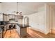 Bright kitchen features grey cabinets, granite countertops, hardwood flooring and stainless steel appliances at 1873 Jameson Cir, Lawrenceville, GA 30043