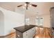 Bright kitchen with granite countertops, hardwood flooring, ceiling fan and breakfast area at 1873 Jameson Cir, Lawrenceville, GA 30043