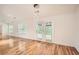 Open living room with hardwood flooring, recessed lighting and access to the outdoors at 1873 Jameson Cir, Lawrenceville, GA 30043