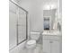 Bathroom featuring a shower and bath tub combination with glass doors and a white vanity at 2362 Saint Davids Nw Sq, Kennesaw, GA 30152