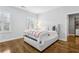 Bedroom featuring hardwood floors, bright windows, and a neutral color palette at 2362 Saint Davids Nw Sq, Kennesaw, GA 30152