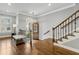 Entryway featuring hardwood floors, an ornate light fixture, and a staircase at 2362 Saint Davids Nw Sq, Kennesaw, GA 30152