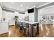 Bright eat-in kitchen featuring white cabinets, stainless steel appliances, and an island with bar seating at 2362 Saint Davids Nw Sq, Kennesaw, GA 30152