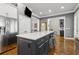 Spacious kitchen featuring an island with seating and is open to other living spaces at 2362 Saint Davids Nw Sq, Kennesaw, GA 30152