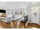 Elegant living room with hardwood floors, fireplace, and built-in shelving at 2362 Saint Davids Nw Sq, Kennesaw, GA 30152