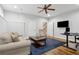 Spacious office area with comfortable seating, a large TV, and an efficient workspace at 2362 Saint Davids Nw Sq, Kennesaw, GA 30152