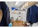 Organized walk-in closet with shelving, hanging rods, and hardwood flooring at 2362 Saint Davids Nw Sq, Kennesaw, GA 30152
