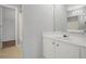 Bathroom featuring neutral walls, white cabinets and open view to large closet at 2372 Johnson Rd, Atlanta, GA 30345