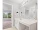 Vanity in a spacious bathroom with a large mirror and neutral walls at 2372 Johnson Rd, Atlanta, GA 30345