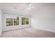 Bright, spacious bedroom with neutral carpet, two large windows, and natural light at 2372 Johnson Rd, Atlanta, GA 30345