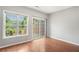 Bright bedroom with large windows, sliding doors, and wood-look flooring at 2372 Johnson Rd, Atlanta, GA 30345
