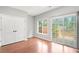 Comfortable bedroom with closet, sliding doors to balcony and light grey walls at 2372 Johnson Rd, Atlanta, GA 30345