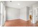 Spacious bedroom with a large sliding door, and wood-look flooring at 2372 Johnson Rd, Atlanta, GA 30345