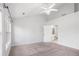 Vaulted ceiling bedroom featuring neutral carpet, ceiling fan, and bathroom access at 2372 Johnson Rd, Atlanta, GA 30345