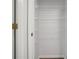 Linen closet with shelving units and a white door at 2372 Johnson Rd, Atlanta, GA 30345