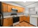 Well-equipped kitchen features maple cabinets, black appliances, and laminate flooring at 2372 Johnson Rd, Atlanta, GA 30345