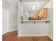 Open-concept kitchen featuring warm wood cabinets and a breakfast bar at 2372 Johnson Rd, Atlanta, GA 30345