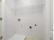 Laundry room with washer and dryer hookups, white walls, and utility sink at 2372 Johnson Rd, Atlanta, GA 30345