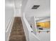 Carpeted staircase ascending to the upper level with white railings and walls at 2372 Johnson Rd, Atlanta, GA 30345