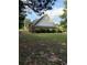 House has a large grass backyard with brick exterior at 2474 Starfire Ln, Loganville, GA 30052