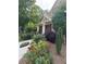 Well-maintained front yard featuring lush greenery, colorful flowers, and a walkway to the entrance at 2474 Starfire Ln, Loganville, GA 30052