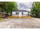Large back deck is great for entertaining and features a newly painted exterior on the home at 2736 Joyce Ave, Decatur, GA 30032