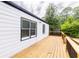 Relaxing back deck featuring a newly painted exterior, and a space for outdoor seating at 2736 Joyce Ave, Decatur, GA 30032