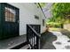 Cozy back entrance with black door and trim, offering a private entry point to the home at 2736 Joyce Ave, Decatur, GA 30032